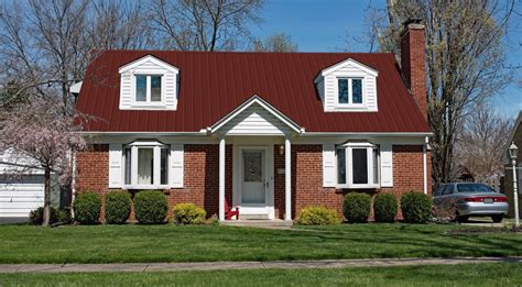 red brick dutch colonial house with metal roof|red brick house metal roof.